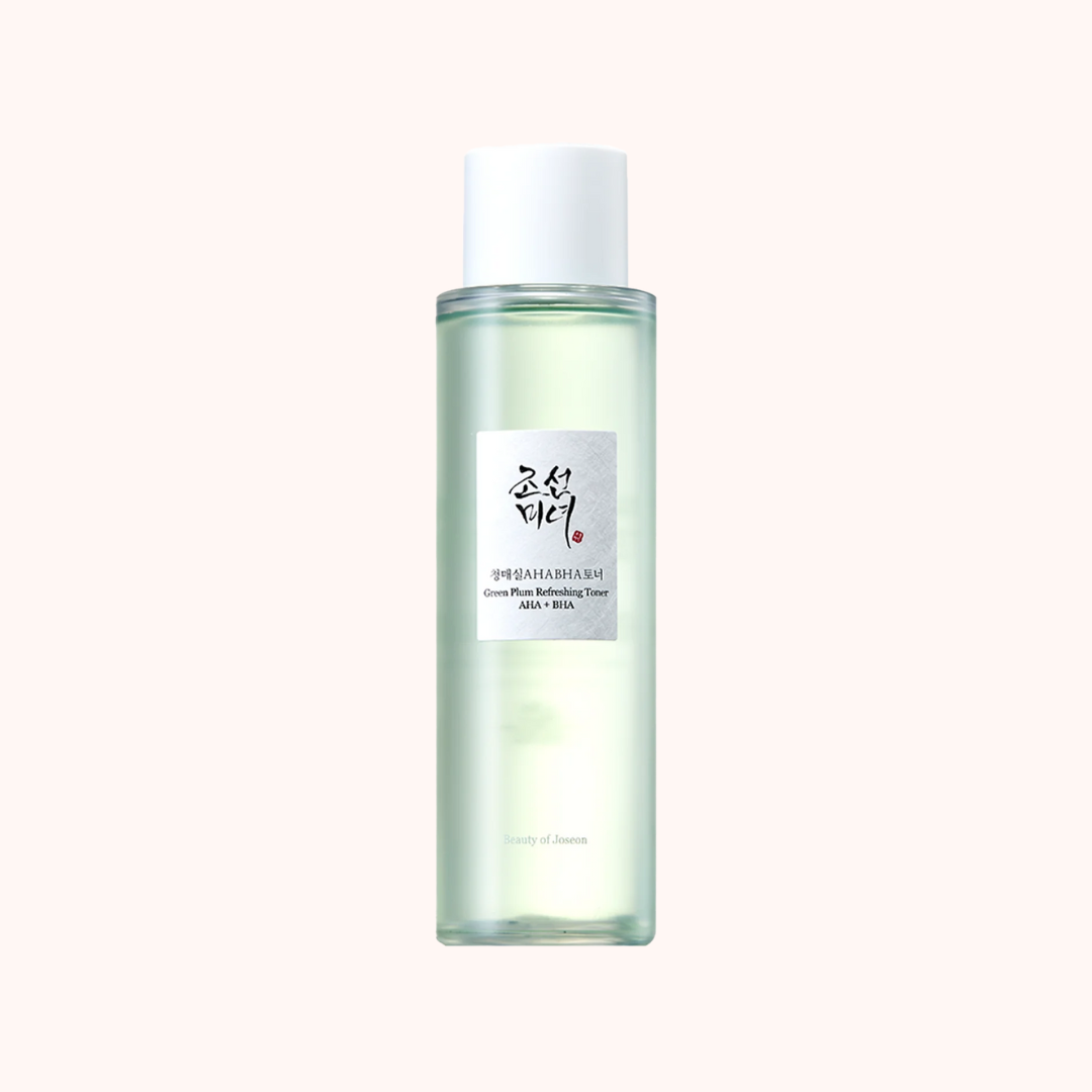 A clear glass bottle containing Beauty of Joseon Green Plum Refreshing Toner with a white cap, labeled in Korean and English.