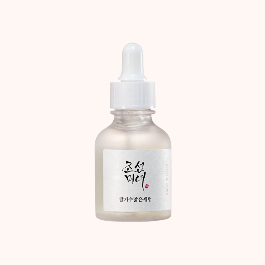 Skincare serum bottle with dropper on a white background