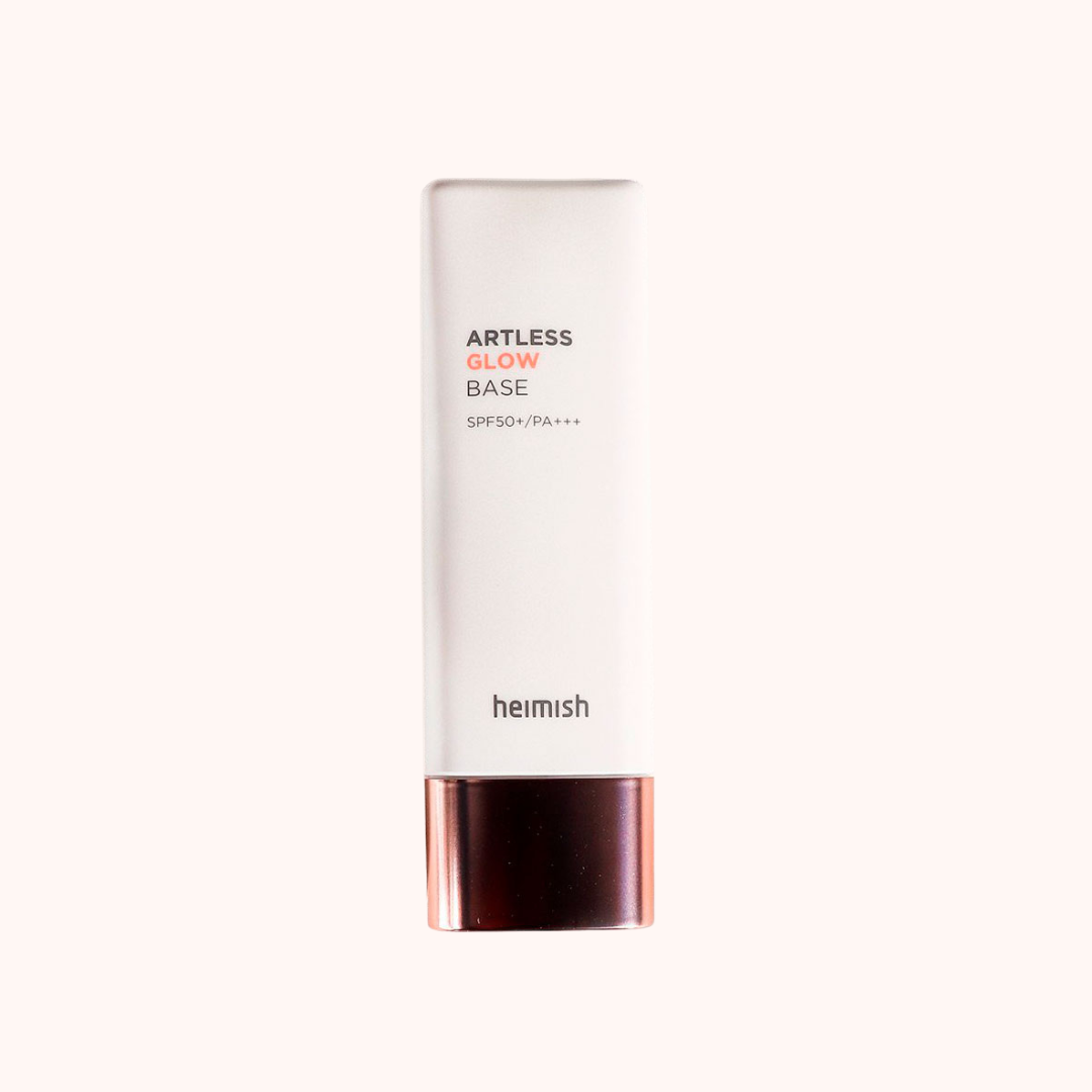 A pump bottle of Heimish Artless Glow Base SPF 50+/PA+++ with a white and rose gold design.