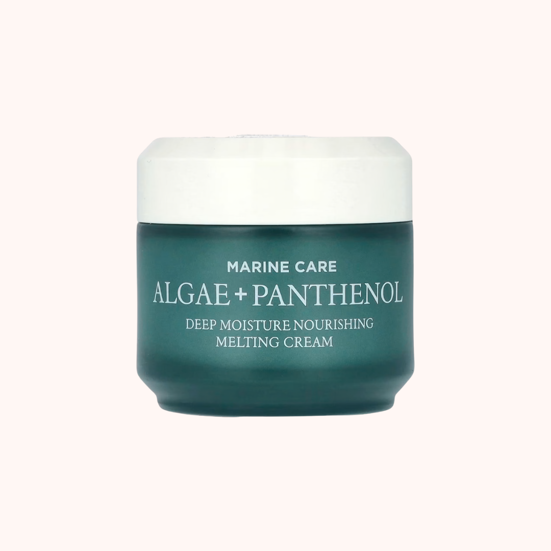 Green jar of marine care cream with white lid on a white background