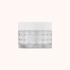 Skincare jar with white lid on a white background