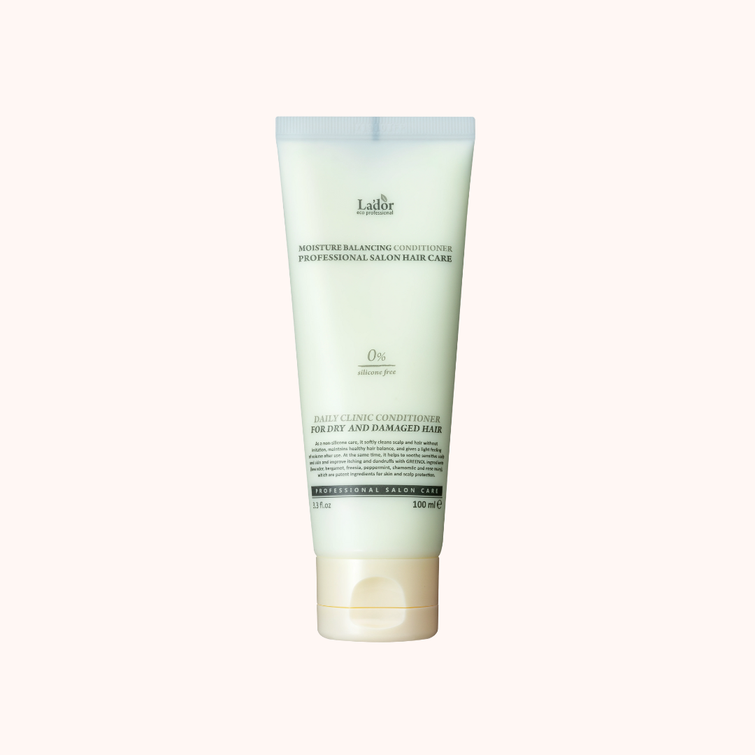Tube of conditioner with visible branding on a white background