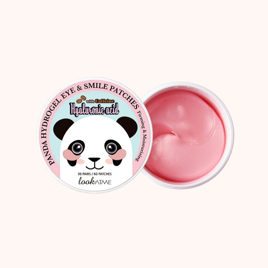 A container of Look At Me Panda Hydrogel Eye Patches, with the product visible through the lid. The packaging is pink with a graphic of a smiling panda and text detailing the product&