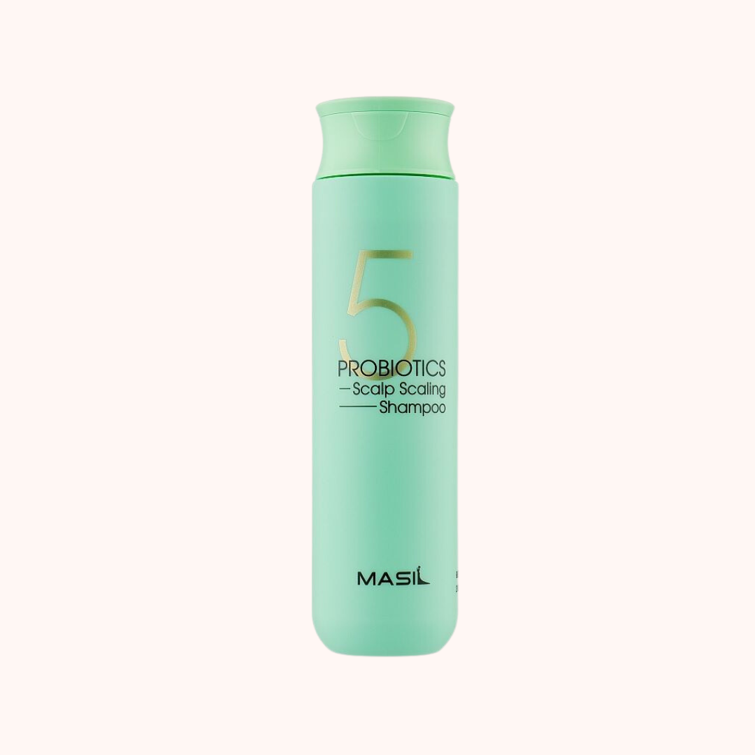 A bottle of MASIL 5 Probiotics Scalp Scaling Shampoo in green color with white and black text, indicating the product name and features.