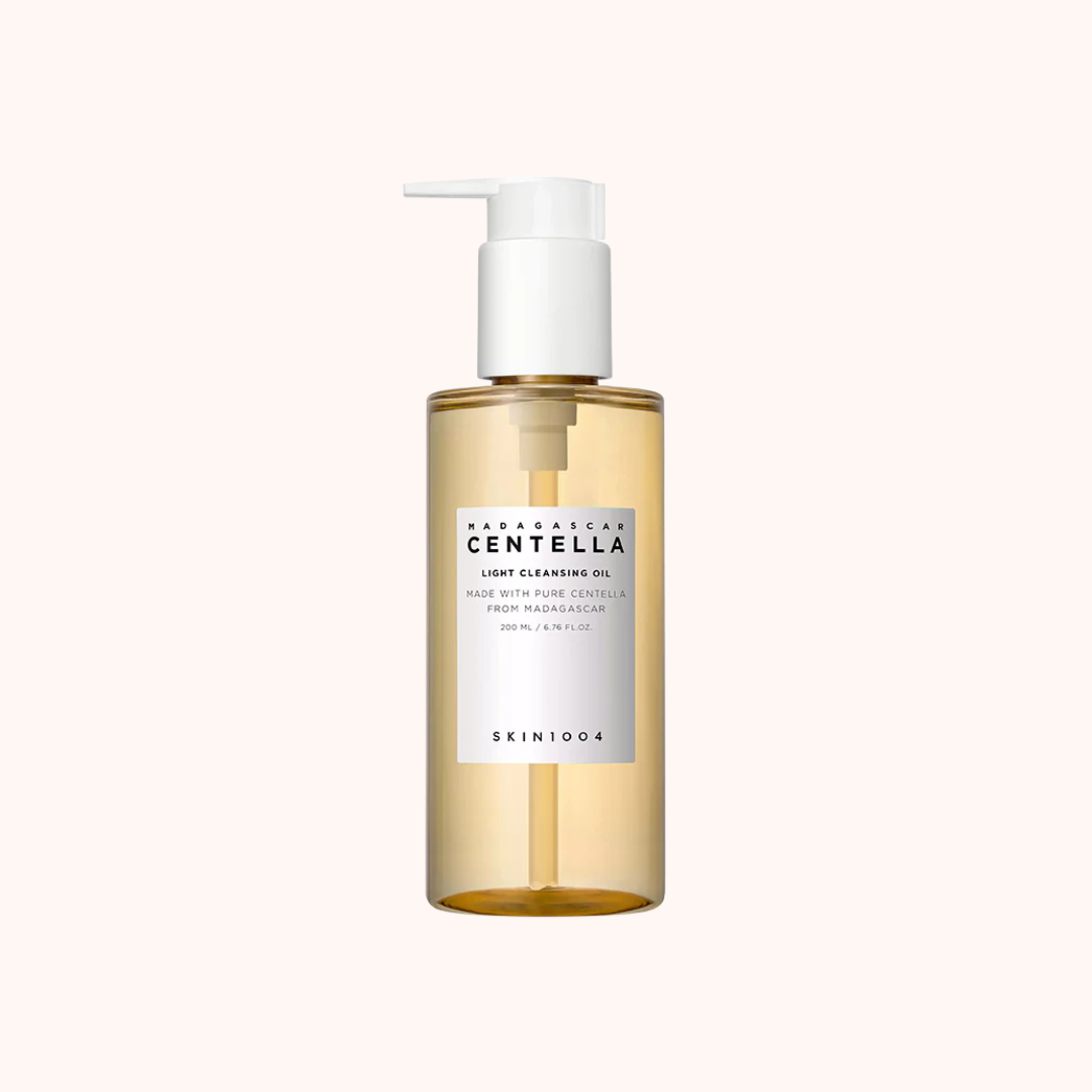 Skincare bottle with a white pump on a light beige background
