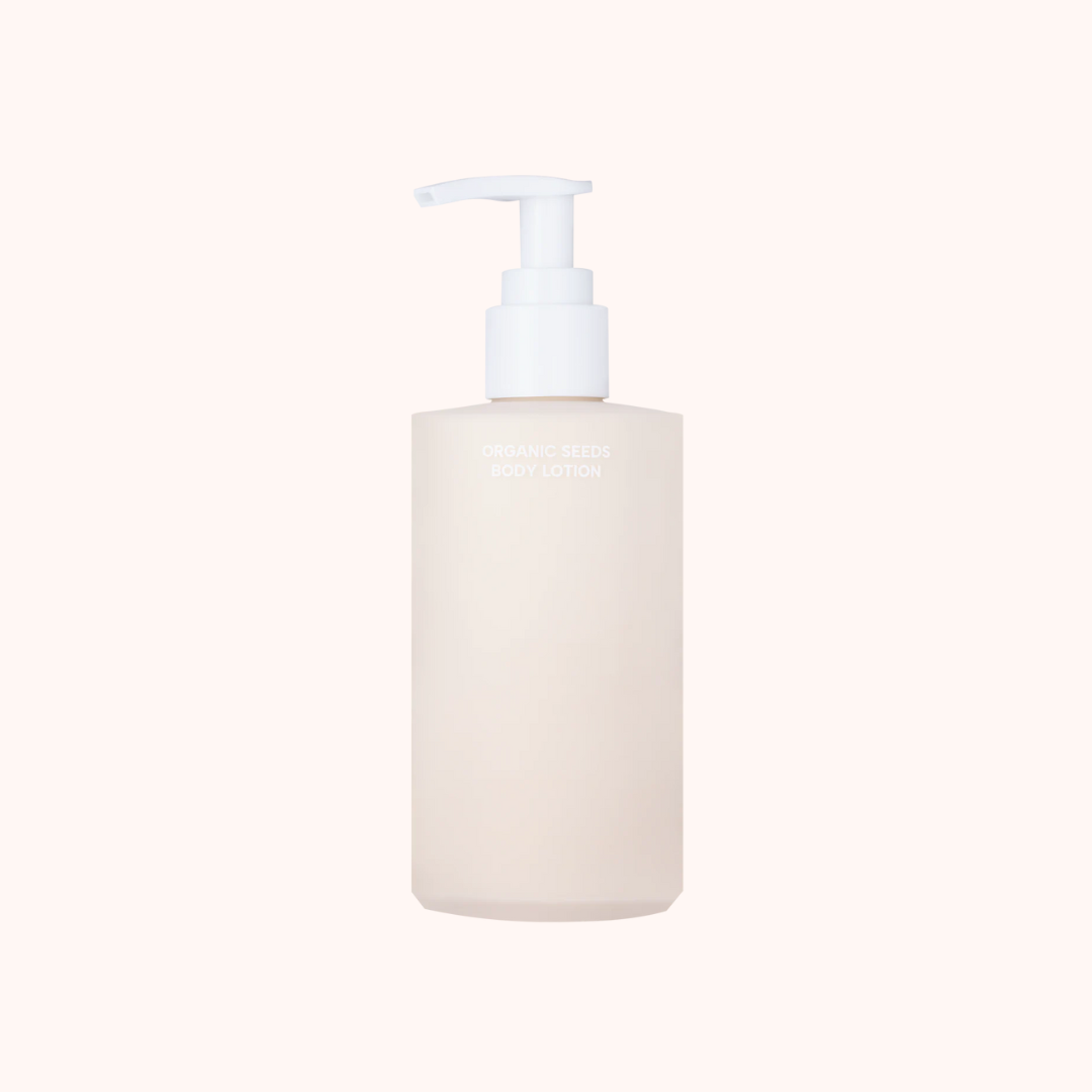 White soap dispenser with pump on a white background