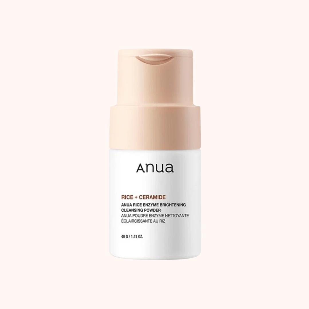 A container of Anua Rice Enzyme Brightening Cleansing Powder with a pink-toned design, labeled as a skin brightening product.