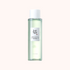 A clear glass bottle containing Beauty of Joseon Green Plum Refreshing Toner with a white cap, labeled in Korean and English.