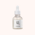 Skincare serum bottle with dropper on a white background