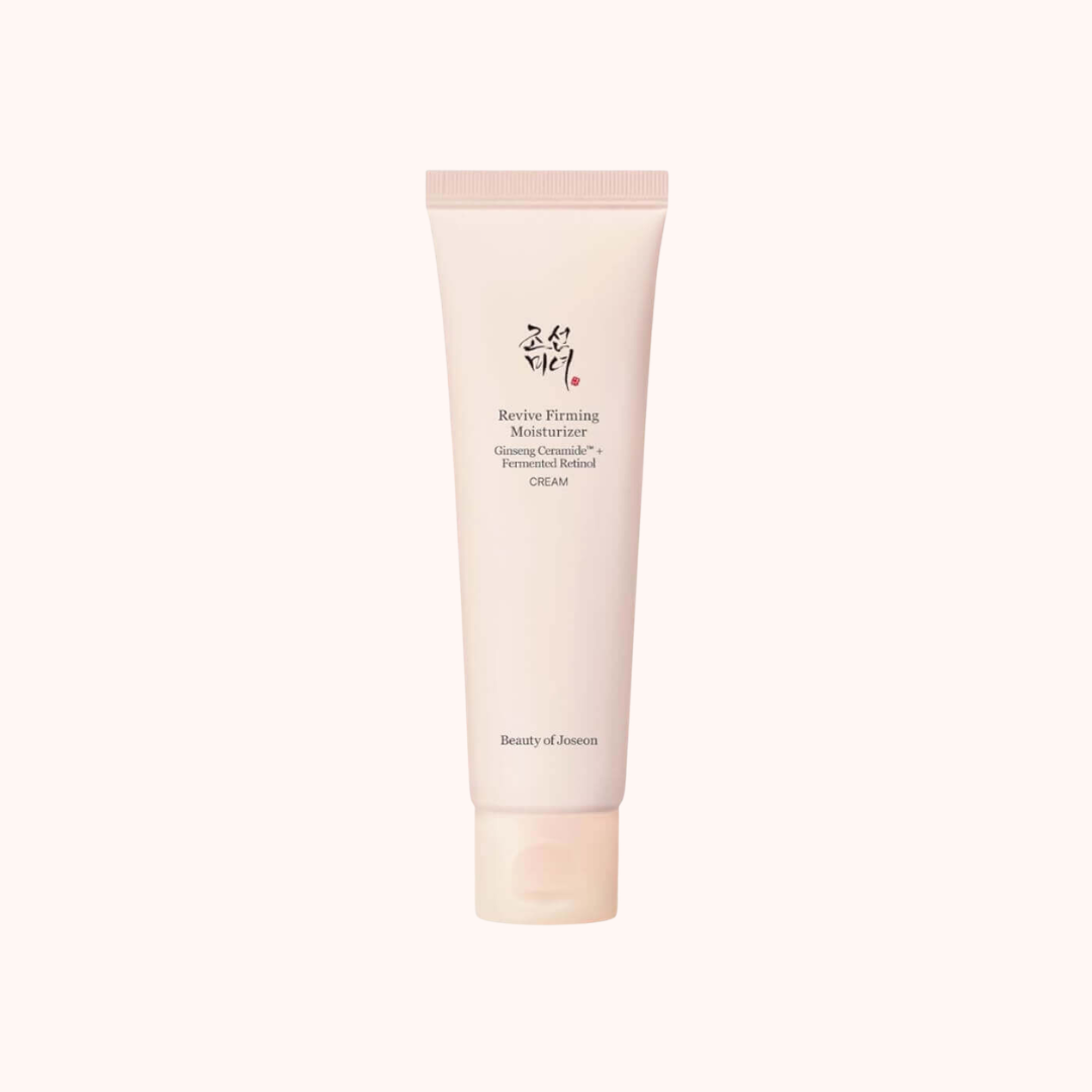 Beauty of Joseon Revive Flaming Moisturizer Glowing Cream in a pale pink squeeze tube, centered on a very light cream background.