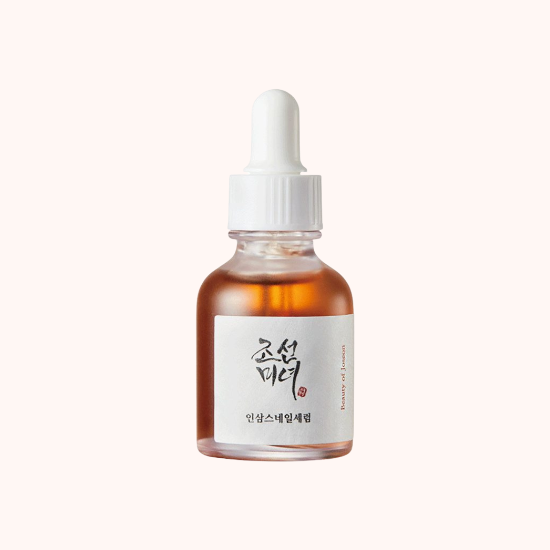 Bottle of skincare serum with a dropper on a white background