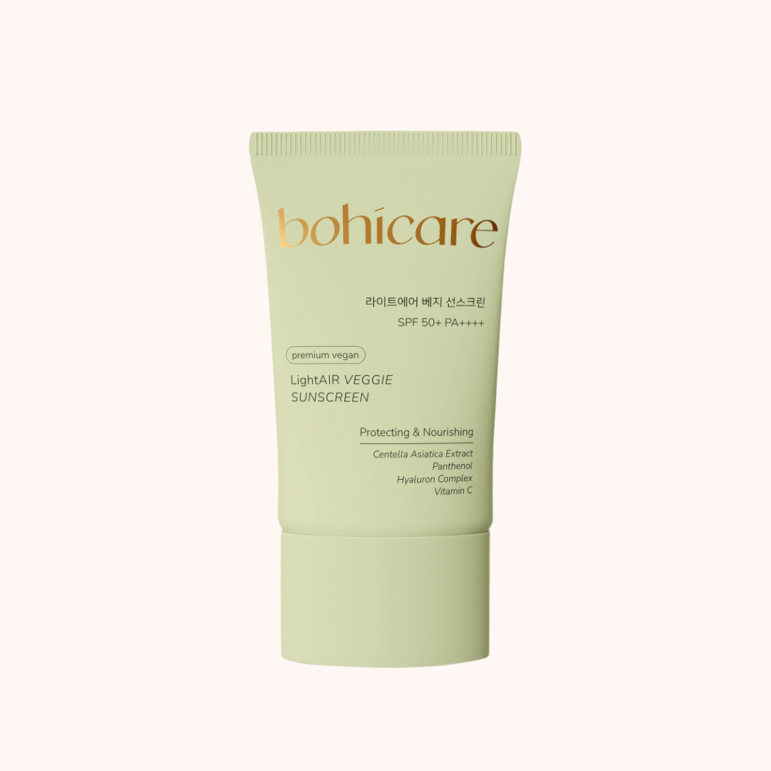 A tube of Bohicare Lightair Veggie Sunscreen with SPF50+/PA++++ protection, mainly in green shade, with text highlighting the key ingredients such as Centella Asiatica, Hyaluronic acid, Panthenol, and Vitamin C.