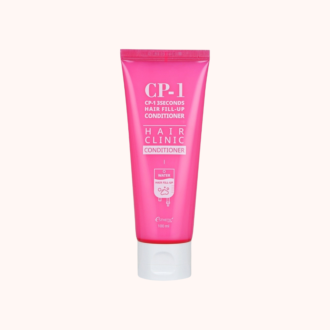 Pink tube of CP-1 Hair Clinic Conditioner on a white background
