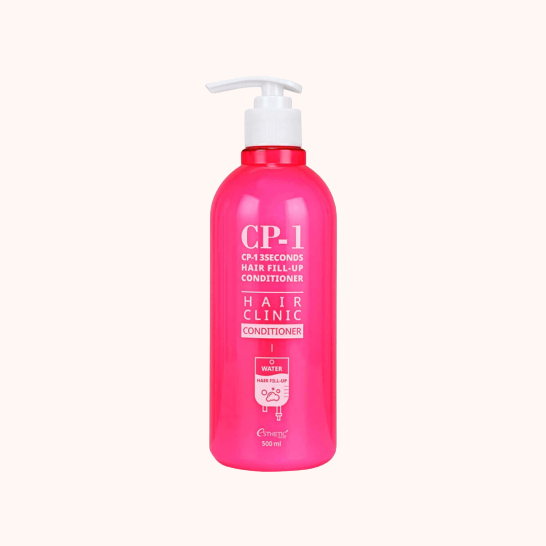 A bright pink pump bottle of eEnergy CP-1 Hair Clinic Hair Fill-Up Conditioner, set against a solid off-white background.