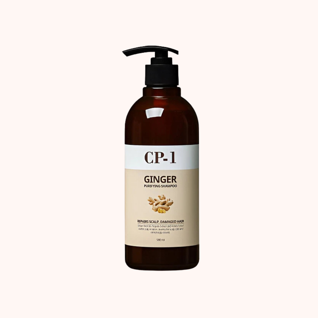 Brown bottle of CP-1 Ginger shampoo with pump on a white background