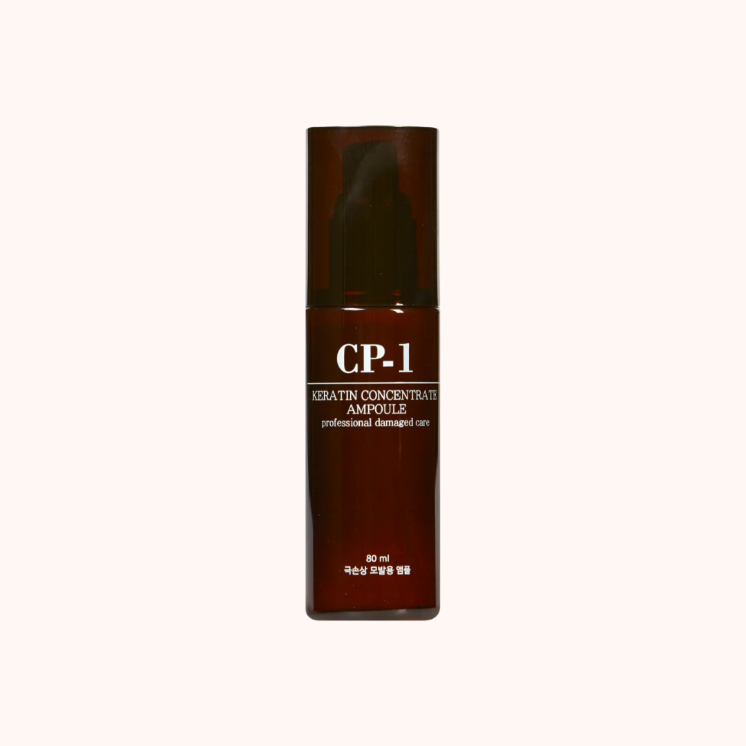 Brown bottle of CP-1 Keratin Concentrate Ampoule on a white background