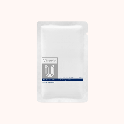 A single white stand-up pouch of Vitamin U Essence Soothing Mask on a solid pale pink background.