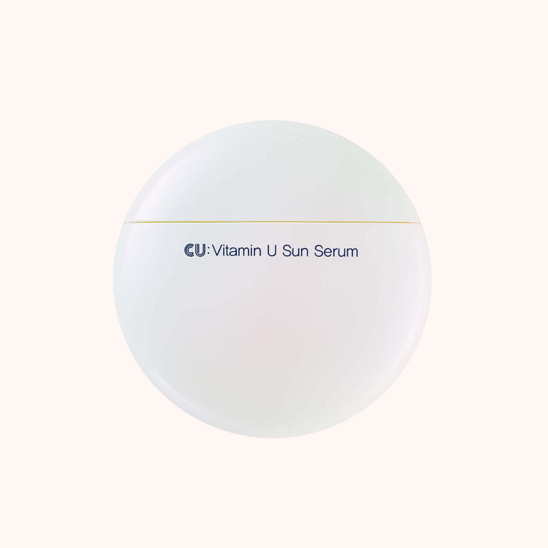 A round white cosmetic jar labeled &