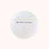 A round white cosmetic jar labeled &