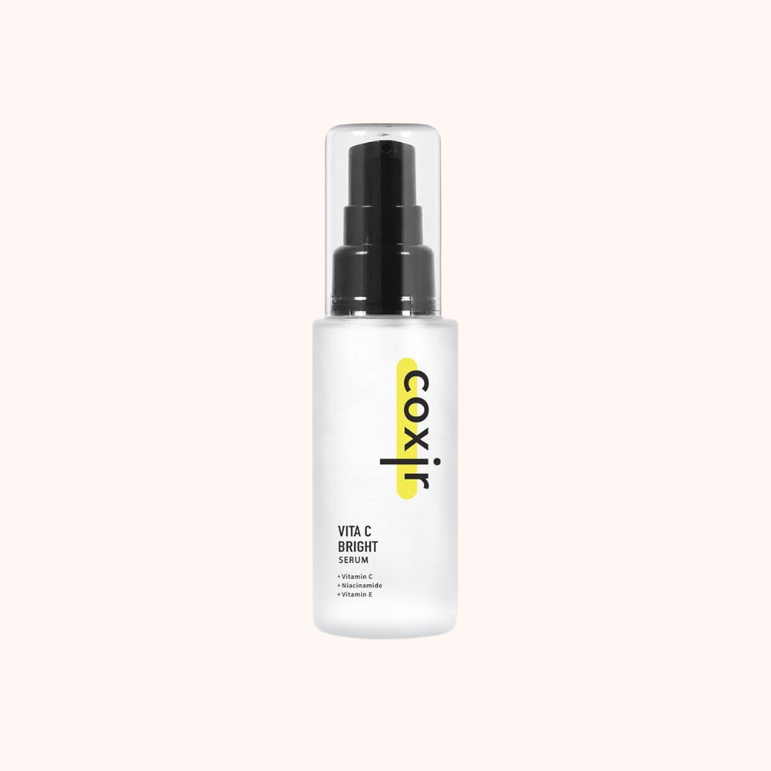 White serum bottle with black cap and &