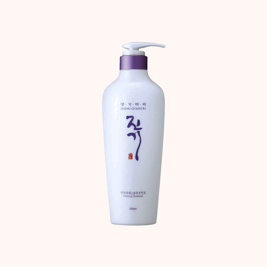 White shampoo bottle with purple pump on a white background