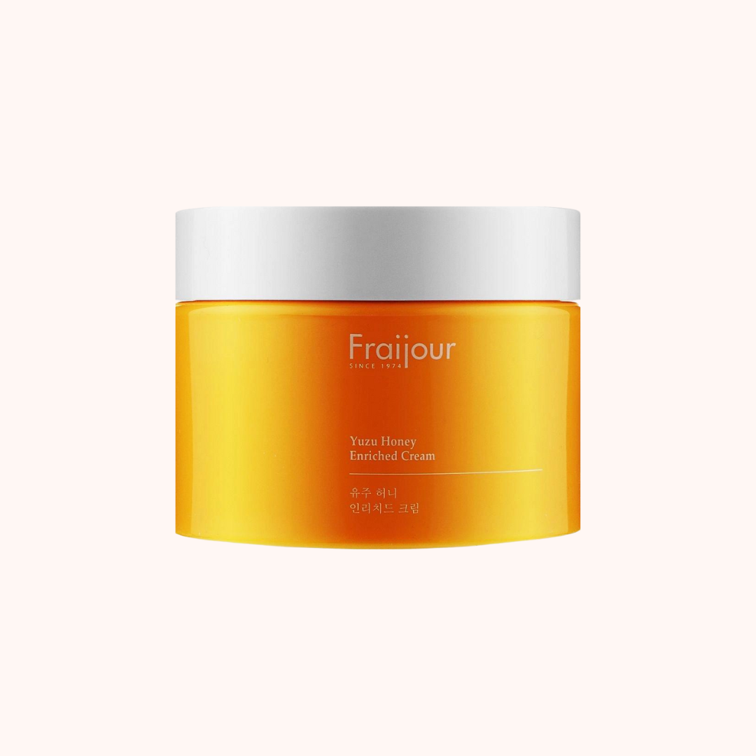 A jar of Fraijour Yuzu Honey Enriched Cream with a yellow label and white lid, indicating it is a 50ml product.