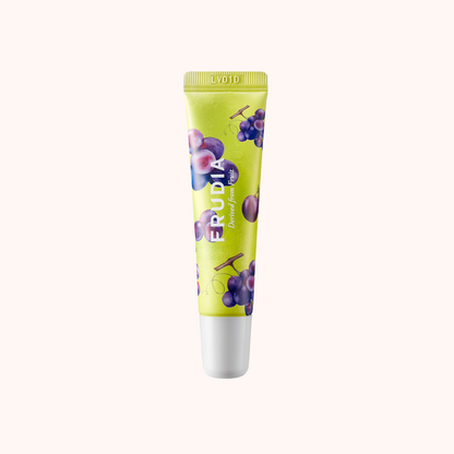 A tube of Frudia Grape Honey Chu Lip Essence with a green color scheme and images of grapes on the packaging.