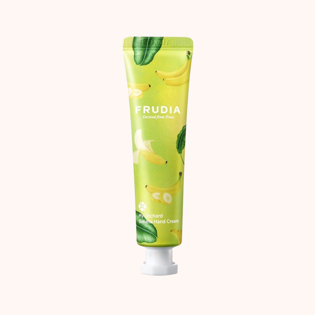 Green hand cream tube with Frudia branding on a white background