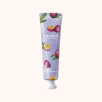 Frudia hand cream tube with fruit illustrations on a white background
