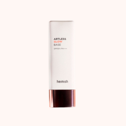 A pump bottle of Heimish Artless Glow Base SPF 50+/PA+++ with a white and rose gold design.