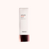 A pump bottle of Heimish Artless Glow Base SPF 50+/PA+++ with a white and rose gold design.