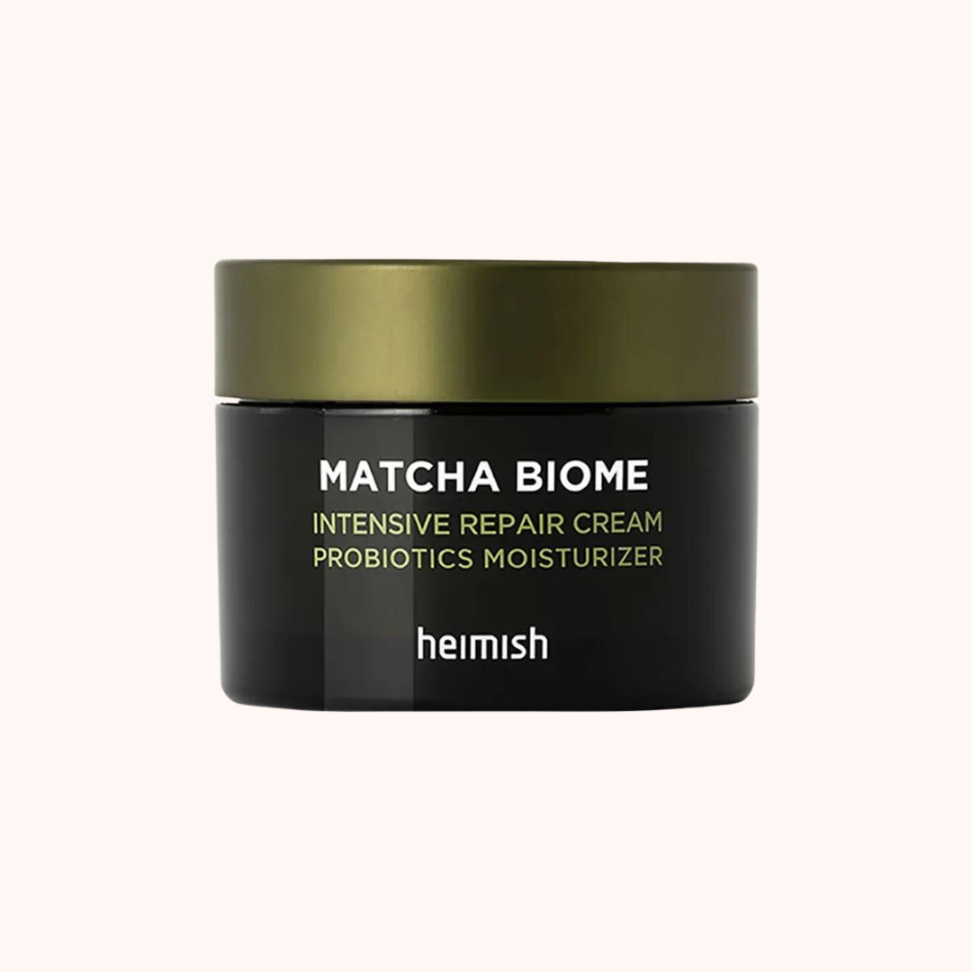 A jar of Heimish Matcha Biome Intensive Repair Cream, which is intended for moisturizing and repairing the skin.