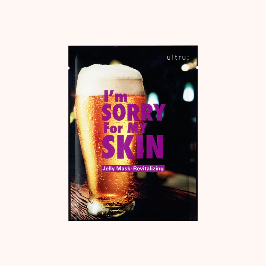 Skincare mask packaging with a glass of beer and text on a white background