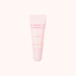 A light pink squeeze tube of Klavuu Nourishing Care Lip Sleeping Pack in Vanilla scent, centered on a very pale pink background.