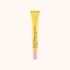 Yellow tube of eye serum with pink cap on a white background