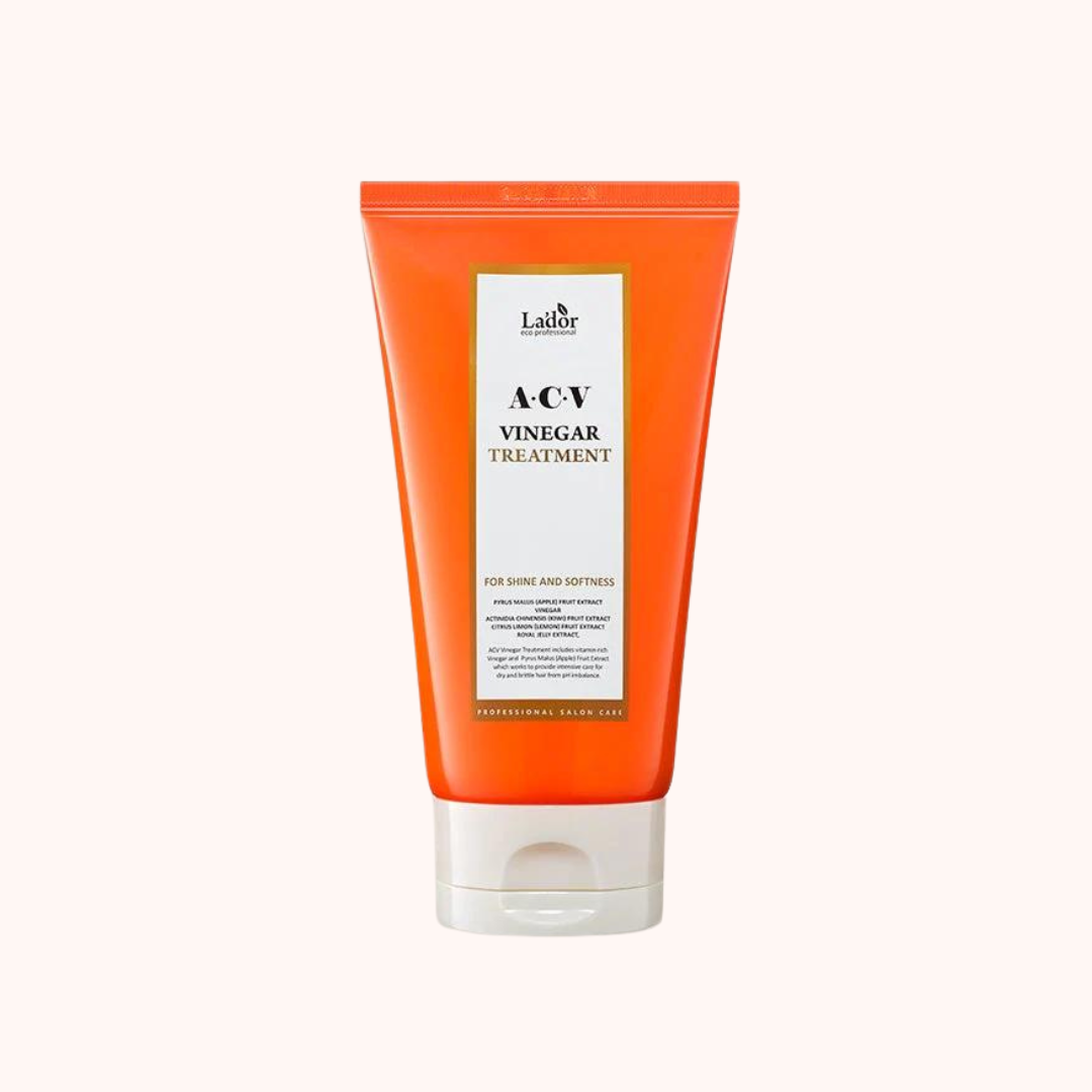 A bottle of Lador Professional Hair Care ACV Vinegar Treatment with a orange and white label.