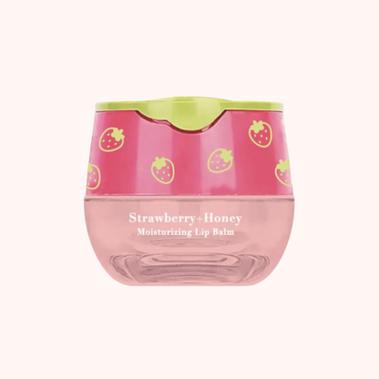 A pot of Look At Me Strawberry-Honey Moisturizing Lip Balm with a pink lid and strawberry print design.