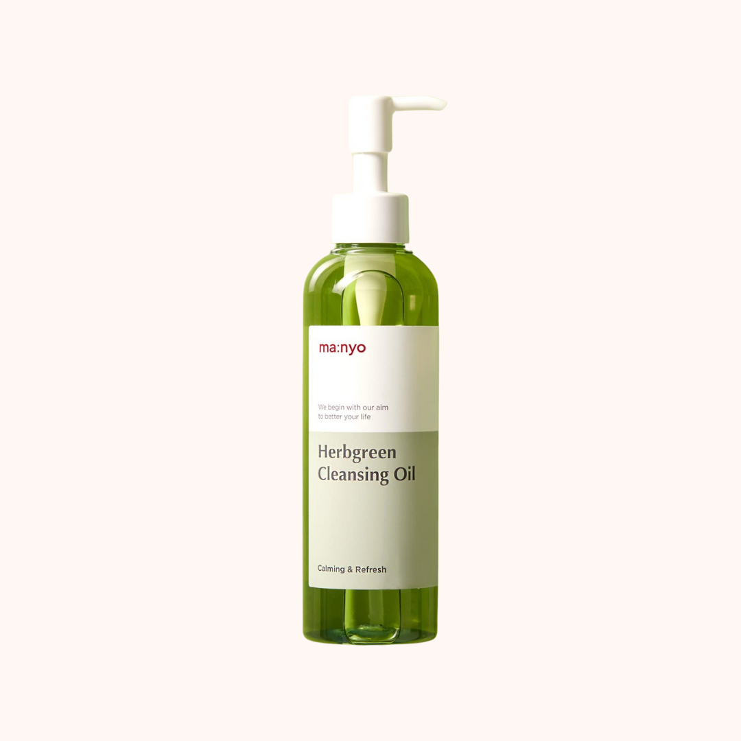 A pump bottle of Ma:nyo Factory Herb Green Cleansing Oil with a green label and white text.