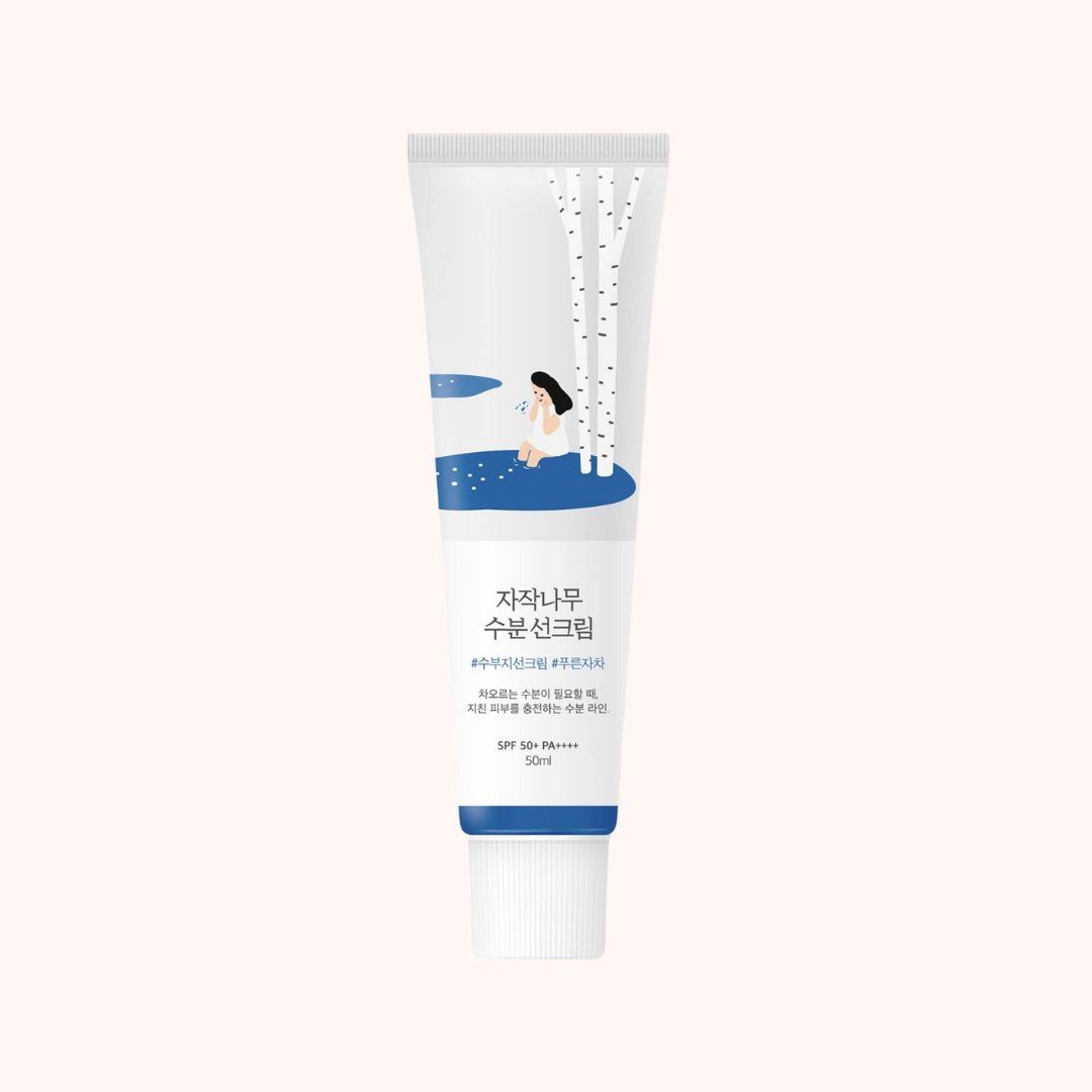 A tube of Round Lab Birch Juice Moisturizing Sunscreen with SPF50+ PA++++, predominantly white with blue accents and Korean text.
