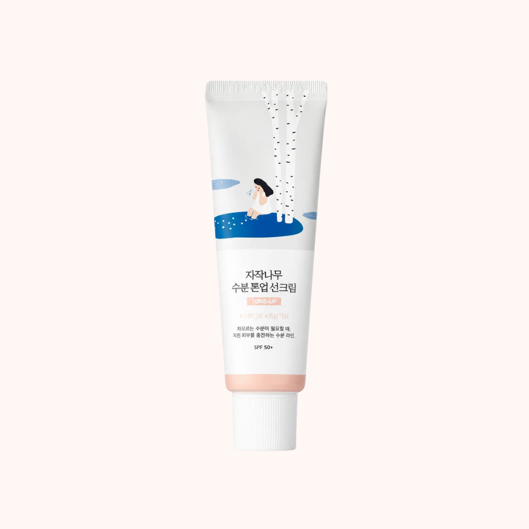 A white cosmetic tube with Korean text and a small illustration of a girl sitting by a blue pool, centered on a very light warm beige background.