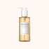 A bottle of SKIN1004 Centella Light Cleansing Oil with a white pump dispenser and a white label, containing a golden-yellow liquid, set against a solid pale pink background.