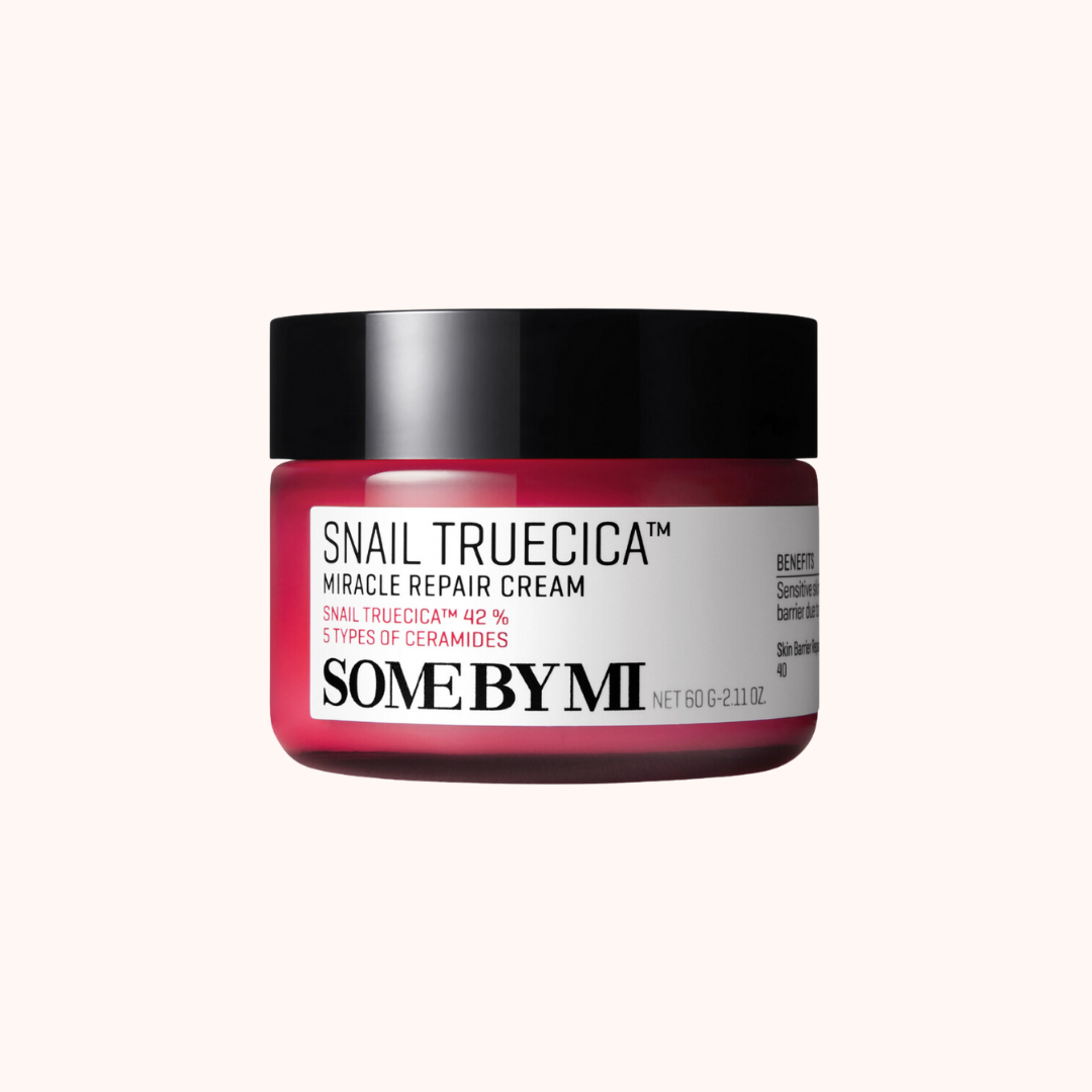 A jar of Some By Mi Snail Truecica Miracle Repair Cream with a pink label and black lid.