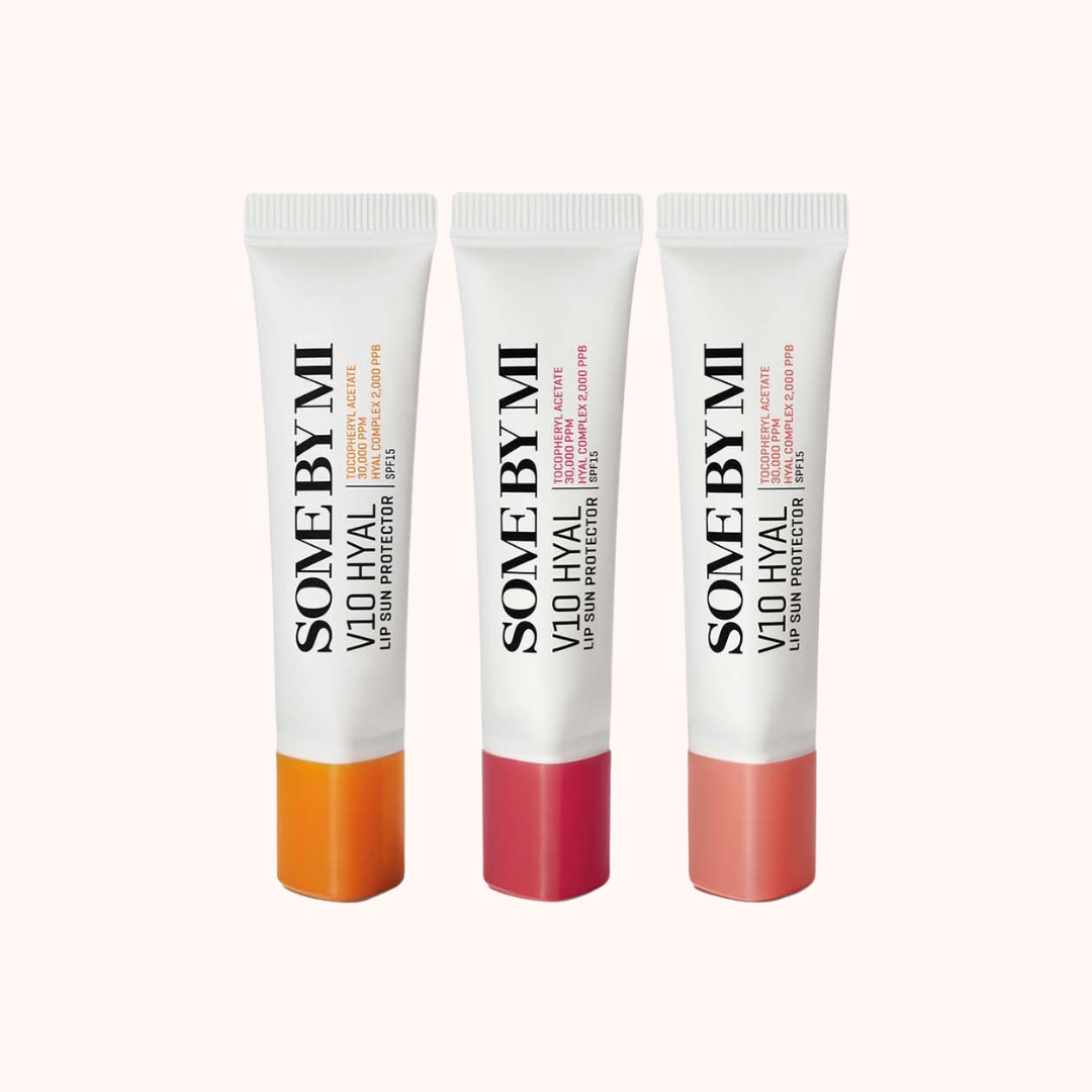 Three lip balm tubes with different colored caps on a white background