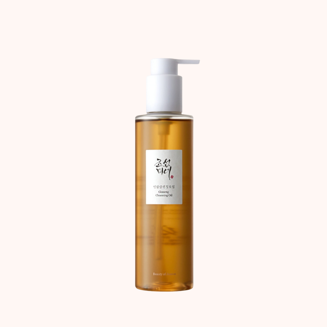 A clear bottle with a pump dispenser containing a yellow-toned cleansing oil, labeled &