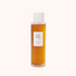 A clear glass bottle with a white cap containing a brown liquid, labeled &