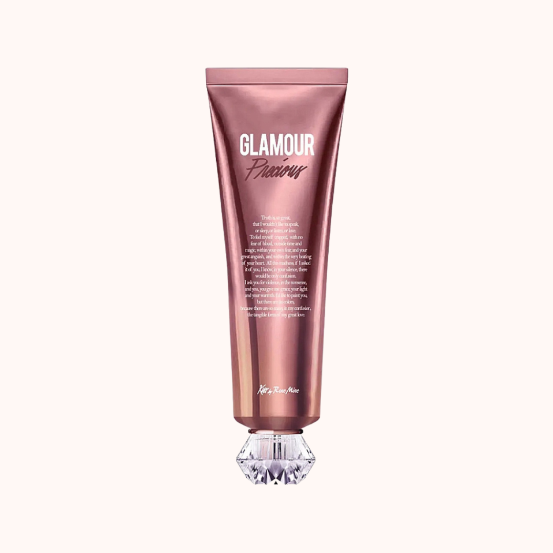 A tube of Kiss by Rosemine Fragrance Body Cream - Glamour Precious with a pink and white color scheme.