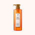 A bottle of Lador Professional Hair Care ACV Vinegar Shampoo with a pump dispenser, predominantly orange in color with a white label.