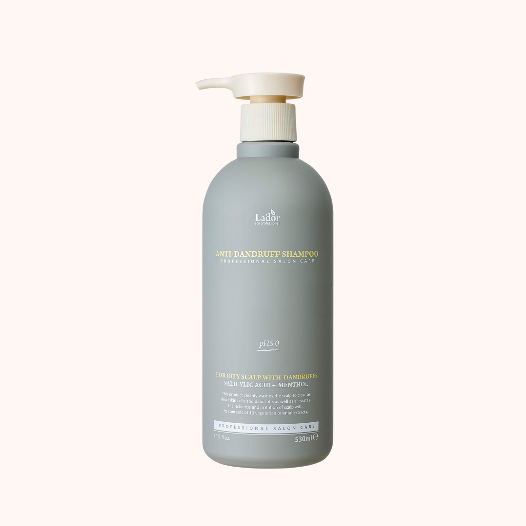 A gray bottle of Lador Professional Hair Care Anti-Dandruff Shampoo with a pump dispenser, labeled 530ml.
