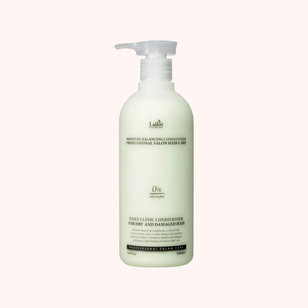 A pump bottle of Lador Professional Hair Moisture Balancing Conditioner with a label that includes the product name and the fact that it is silicone-free.